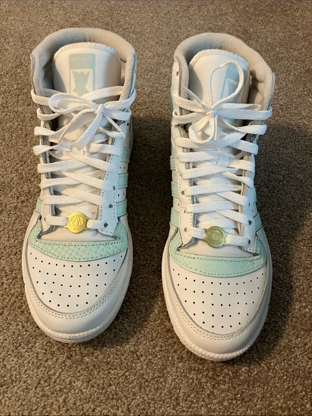 Woman’s White Adidas Top Ten Sneakers with Teal Accents